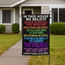 In This House We Believe Dogs Control The Weather Garden Flag