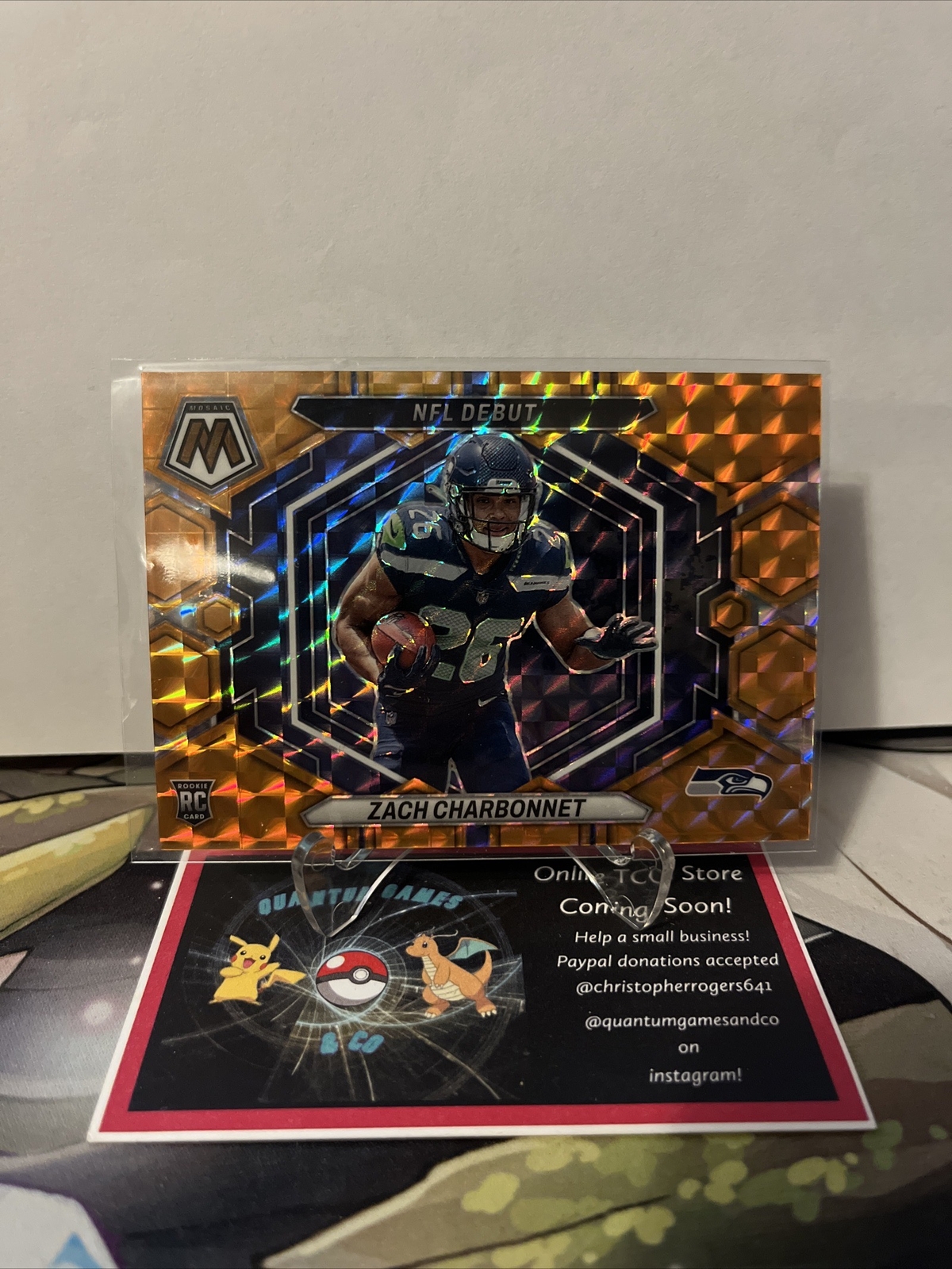 Zach Charbonnet 2023 Panini Mosaic NFL Debut #ND-11 Orange Prizm #’d 028/199 Rc