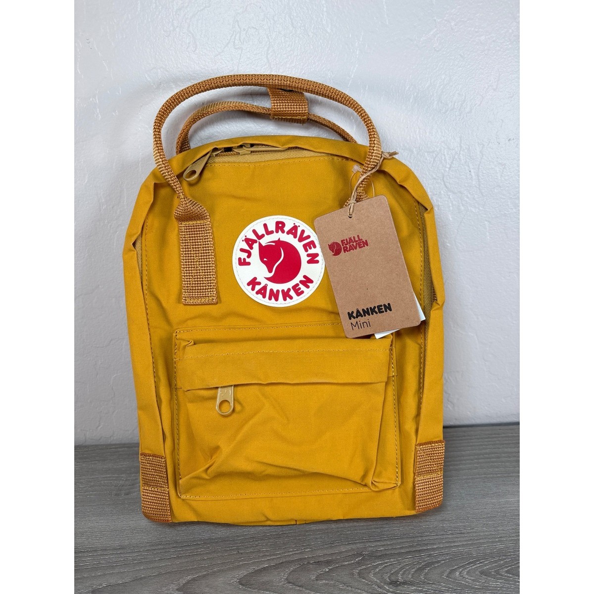 fjallraven kanken ochre mini backpack FJLLRVEN Knken Hiking Backpack, Unisex Adult simple shoulder straps and handles at the top Mini Backpacks Mustard Yellow Kanken