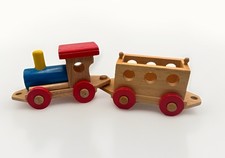 classic wooden toy train with an engine and a car. Read See Photos