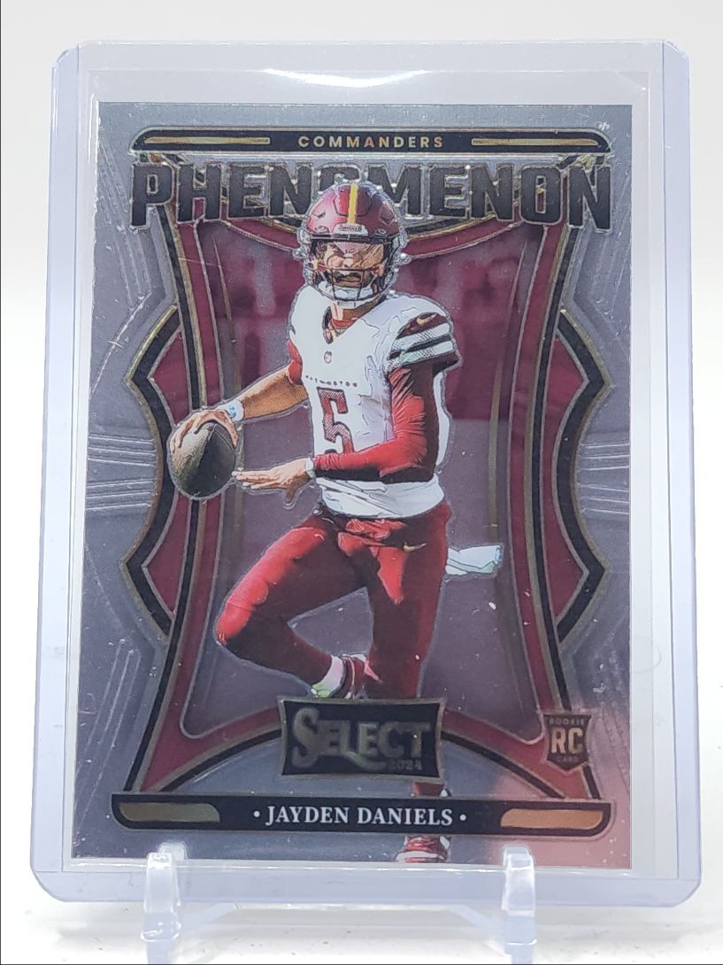 JAYDEN DANIELS 2024 SELECT PHENOMENON ROOKIE COMMANDERS B RC Q1300-H