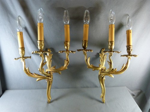 Pair of Louis XV Rocaille Style Three-Armed Wall Sconces in Gilt Bronze