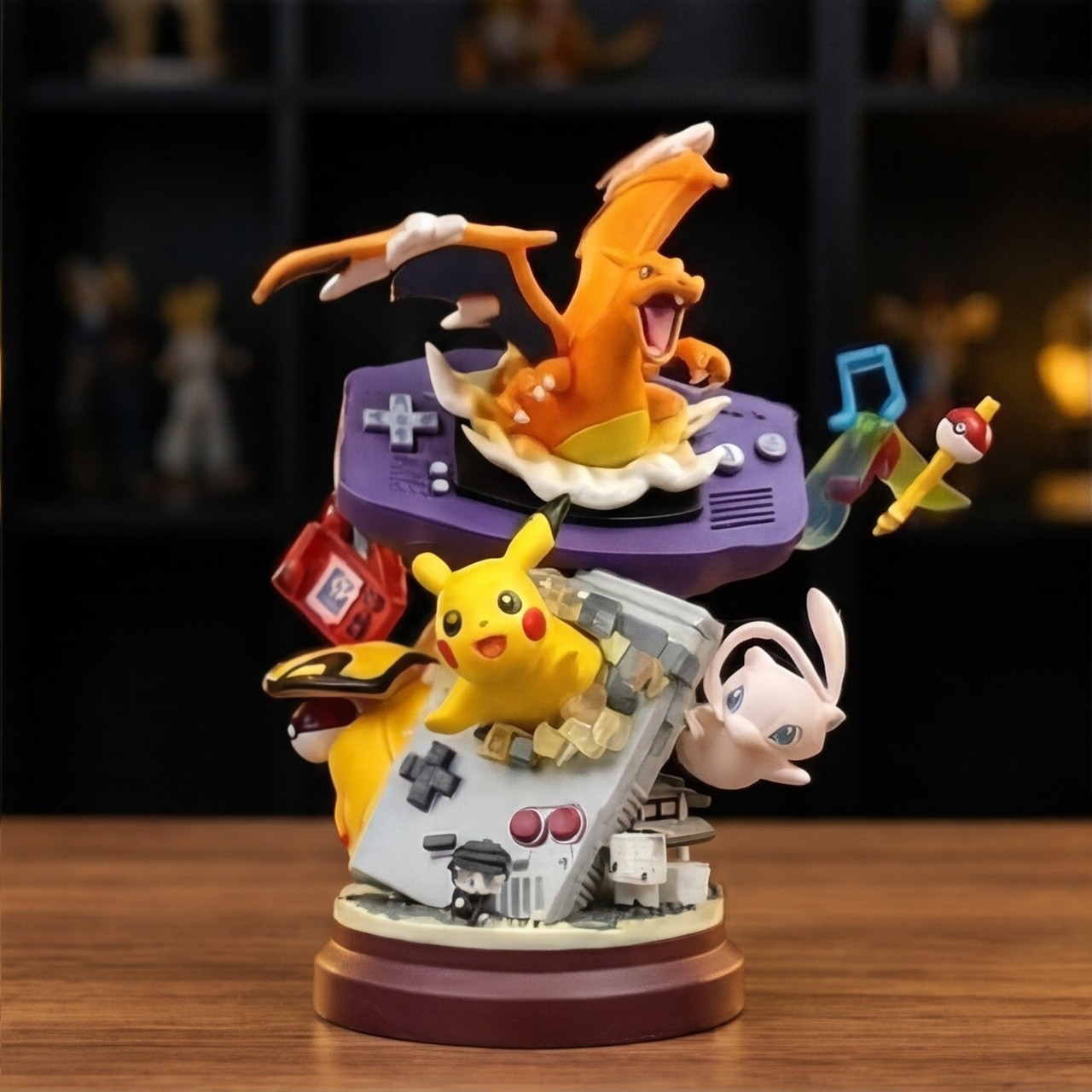 Diorama Pokémon Dracaufeu et console rétro pour décorer un espace de jeu vidéo ou un bureau
