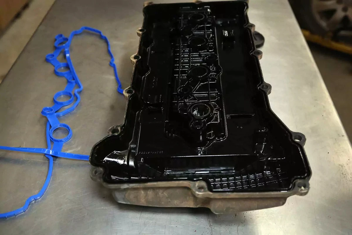 The blue gasket has been removed from the valve cover.