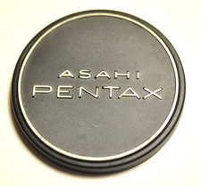 Asahi Pentax metal slip-on front lens cap. Fits over 49mm filter.