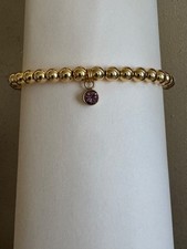 womens hand made gold plated bracelet with February birthstone charm