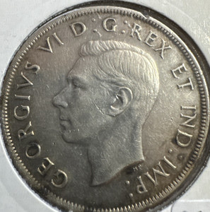 1945 Canadian Silver Dollar. 33,391 Minted VF Details ( Rim Bumps see photos)