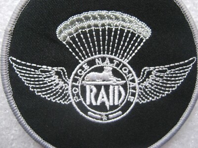 ECUSSON P.N LE RAID OPEX (FOND NOIR) ETAT EXCELLENT SCRATCH AU DOS 100MM