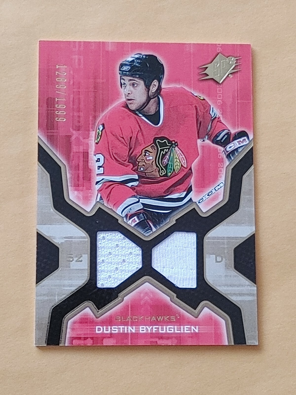 2006-07 SPX Jersey #143 Dustin Byfuglien RC #/1999 Chicago Blackhawks 