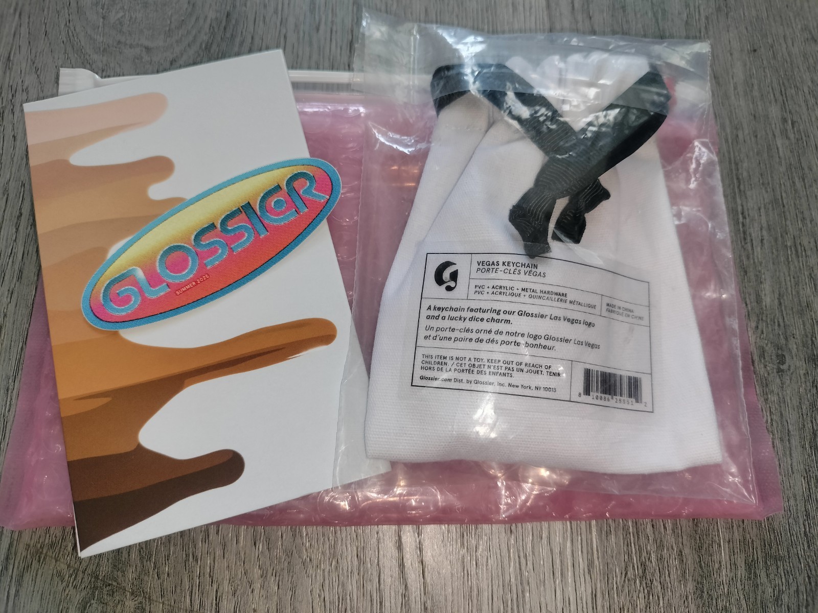 Limited Edition GLOSSIER Las Vegas Logo Dice Keychain + Sticker + Bubble Pouch 