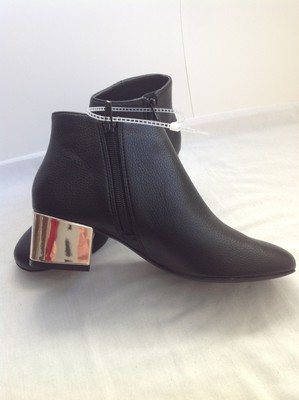 black booties with gold heel