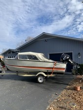 1961 CRESTLINER FLYING CREST BOAT WITH NEW 50 HR TOHAWU MOTOR & TRAILER