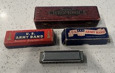 Four vintage harmonicas. One Super Chromatica from Hohner plus 3 vintage USArmy