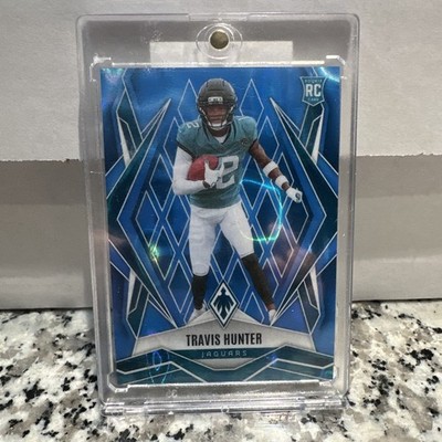 2025 Panini Phoenix - Rookies Travis Hunter #157 Light Blue Lava /325 (RC)
