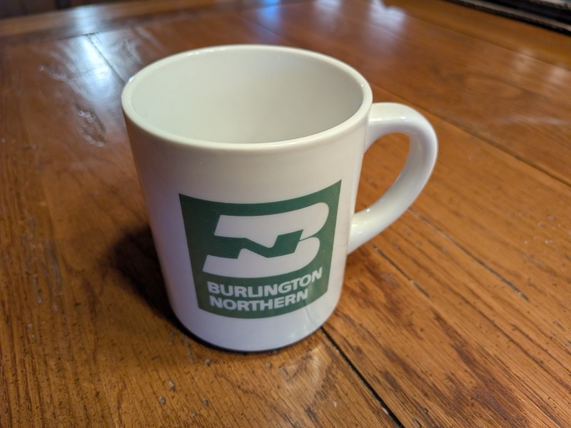 NEW WHISTLE STOP MUG WITH THE BURLINGTON NORTHERN RAILROAD LOGO
