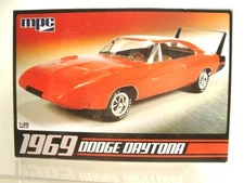 MPC 1969 Dodge Daytona 426 cu. in. 1/25 model kit molded in red with 80 parts