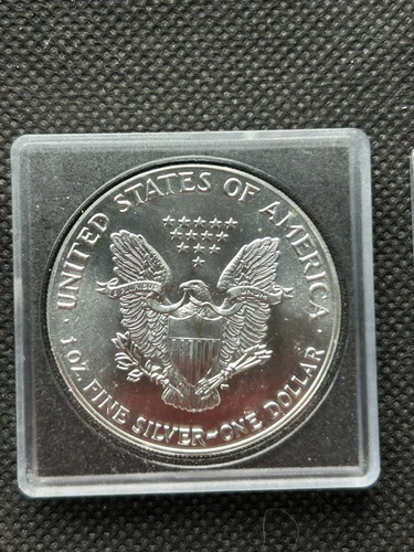 1987 SILVER EAGLE DOLLAR BULLION COIN IN UNCIRCULATED CONDITION (FOUR AVAILABLE)