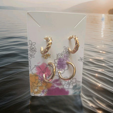 2 Pairs Gold Tone Round Swirled Hoop Earrings...