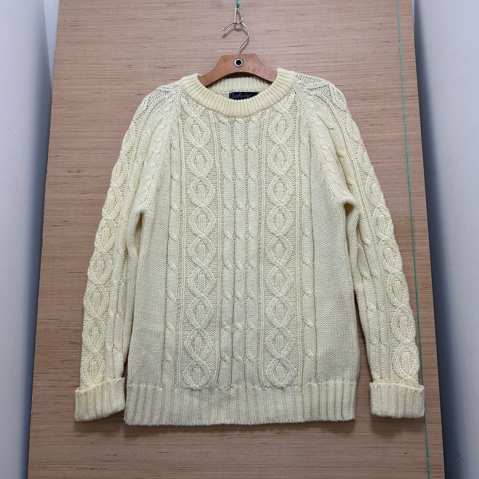Ivory cable-knit crewneck fisherman sweater