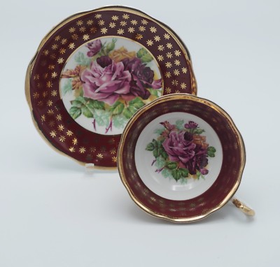  BONE CHINA ENGLAND HEAVY GOLD AND ROSES TEACUP AND SAUCER SET