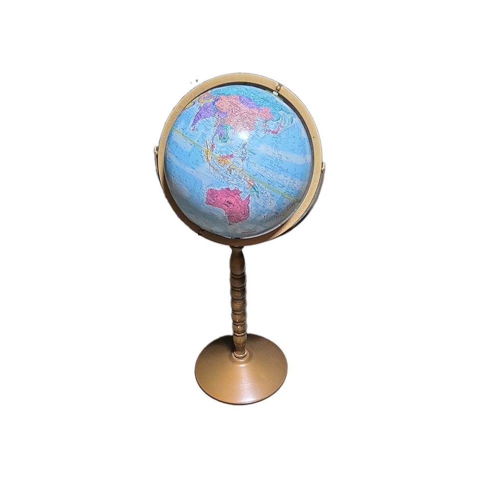 A floor-standing rotating world globe on a wood/metal base — the kind of stately, explorer-vibes statement piece that elevates any study or living room instantly.