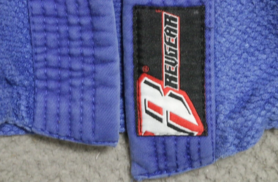 Chaqueta Revgear Jiu-Jitsu Gi Unisex A2 Azul Algodón Banderas Frente Abierto Manga Larga Foto 4 de 4