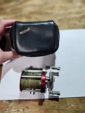 Pflueger Deluxe Knobby Free Spool and case