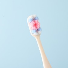 Medium hard bristled household toothbrush