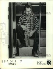 Press Photo Jazz Musician Humberto Ramirez Sits on Bus Step With Trumpet