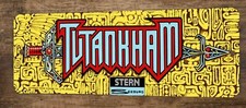 a Tutankham Arcade 4x12 Metal Wall Video Game Sign