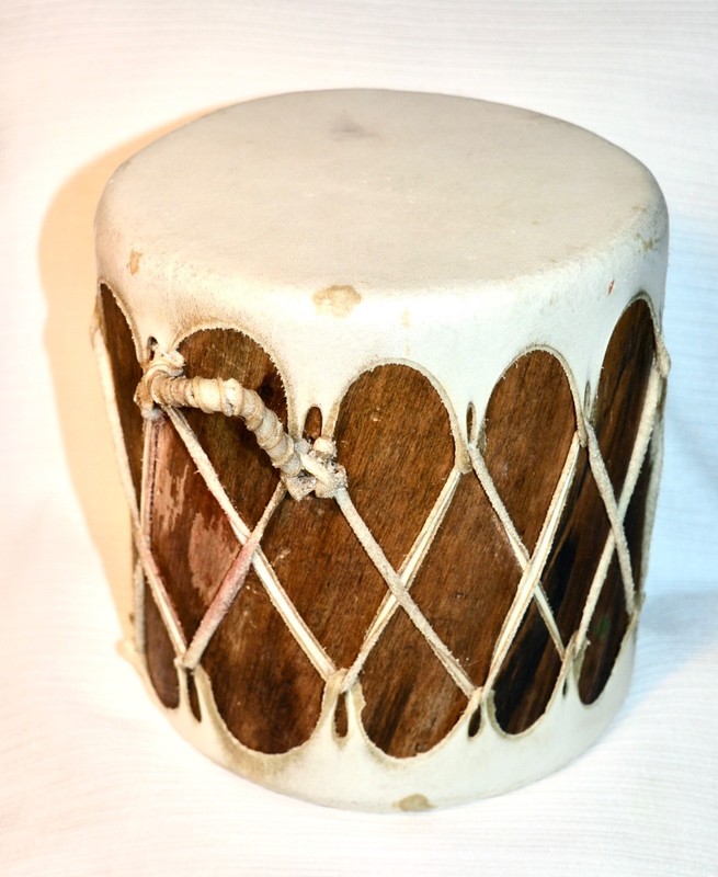 little tight toy drum made of tree trunk covered with leather