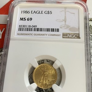 1986 G$5 1/10 Oz. Gold American Eagle Graded by NGC as MS-69. ROMAN NUMERALS.