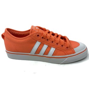 adidas originals nizza canvas sneakers in white and red