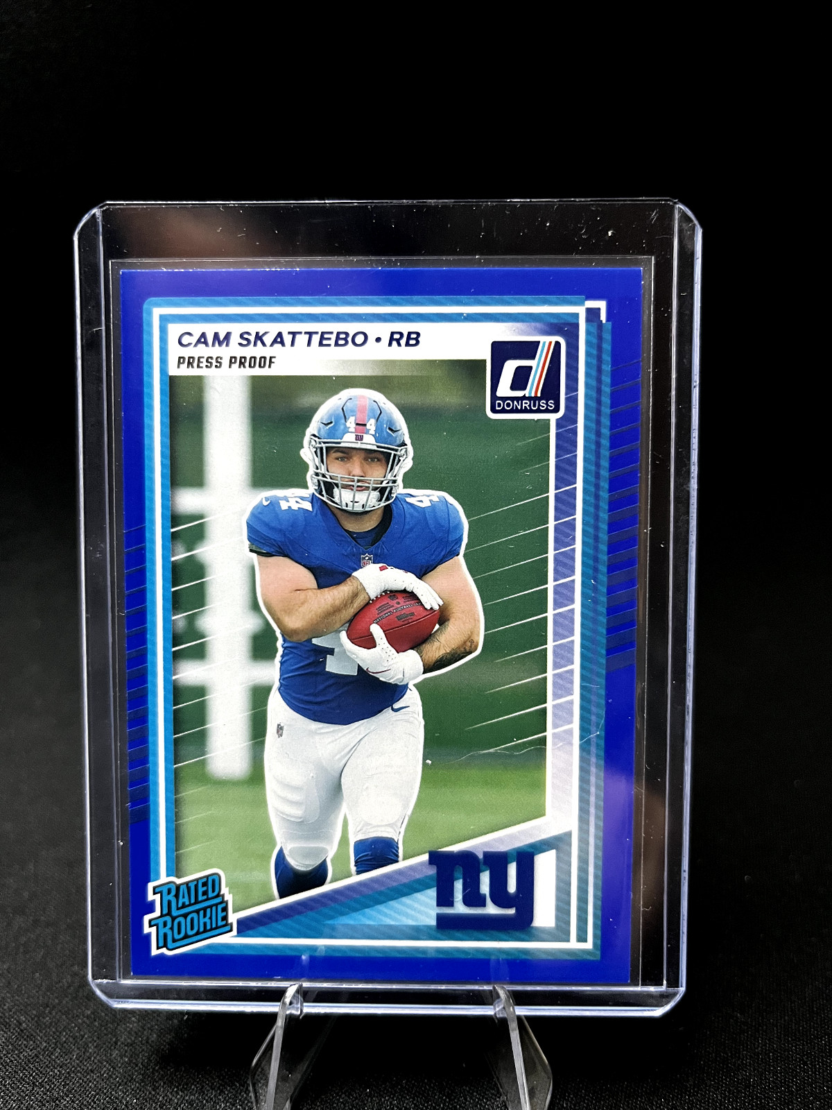 2025 Panini Donruss - Rated Rookie Cam Skattebo #302 Press Proof Blue (RC)
