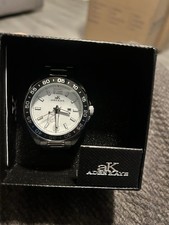 Adee Kaye Analog Wristwatch Silver Metal Band White Dial Black Bezel Round