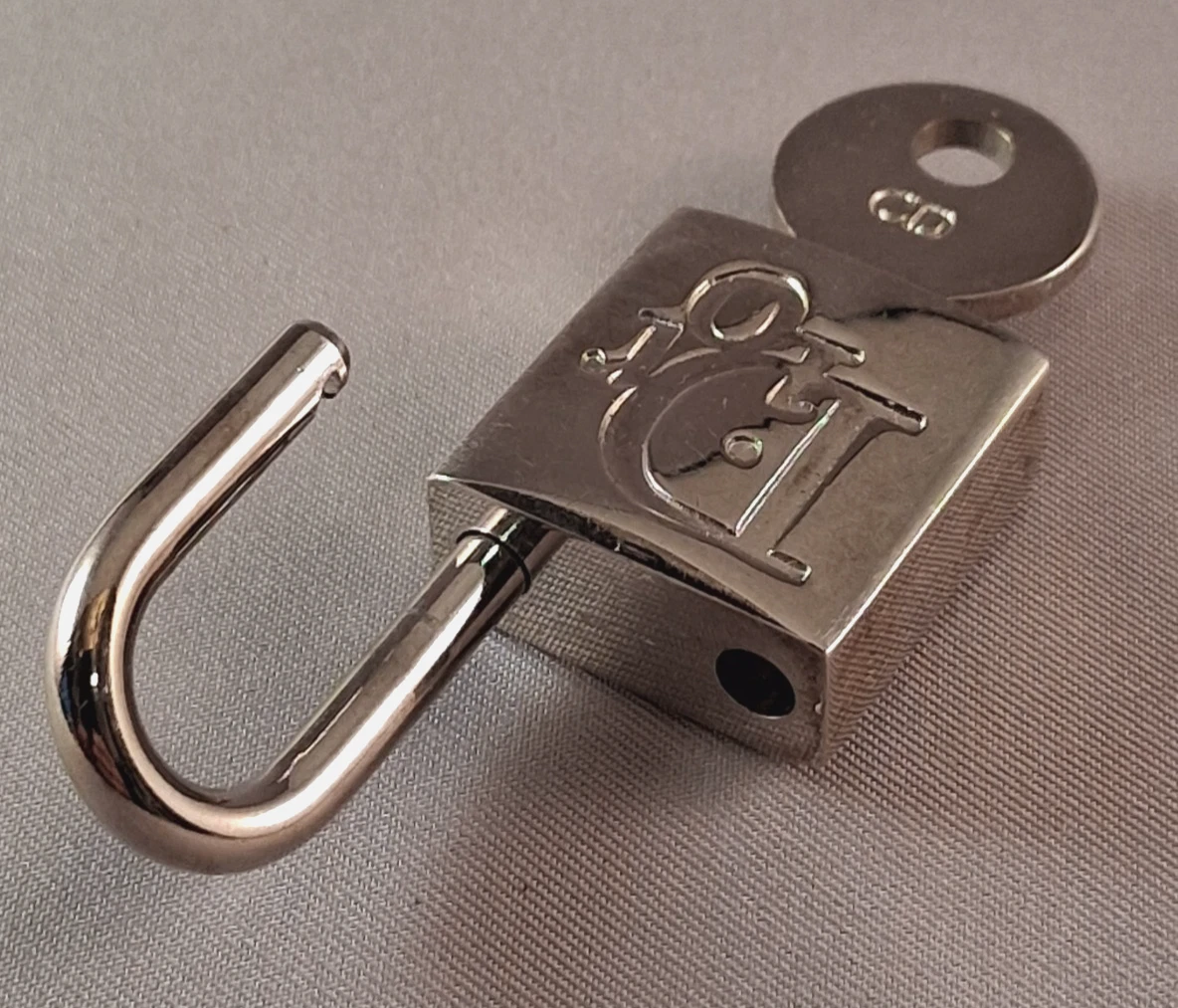 Authentique ensemble cadenas et porte clés Christian Dior logo argenté breloque