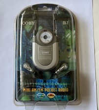 Coby CX-7 Mini AM FM Pocket Radio DBBS Earphones Silver Neck Strap Music Sealed