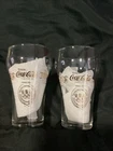 Rare Lot of 2 1976 Vintage Olympic Coca-Cola Gold Lettered Glasses 5 Languages