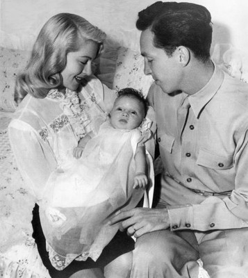 Lana Turner smiles while holding newborn daughter Cheryl Crane nex- Old Photo