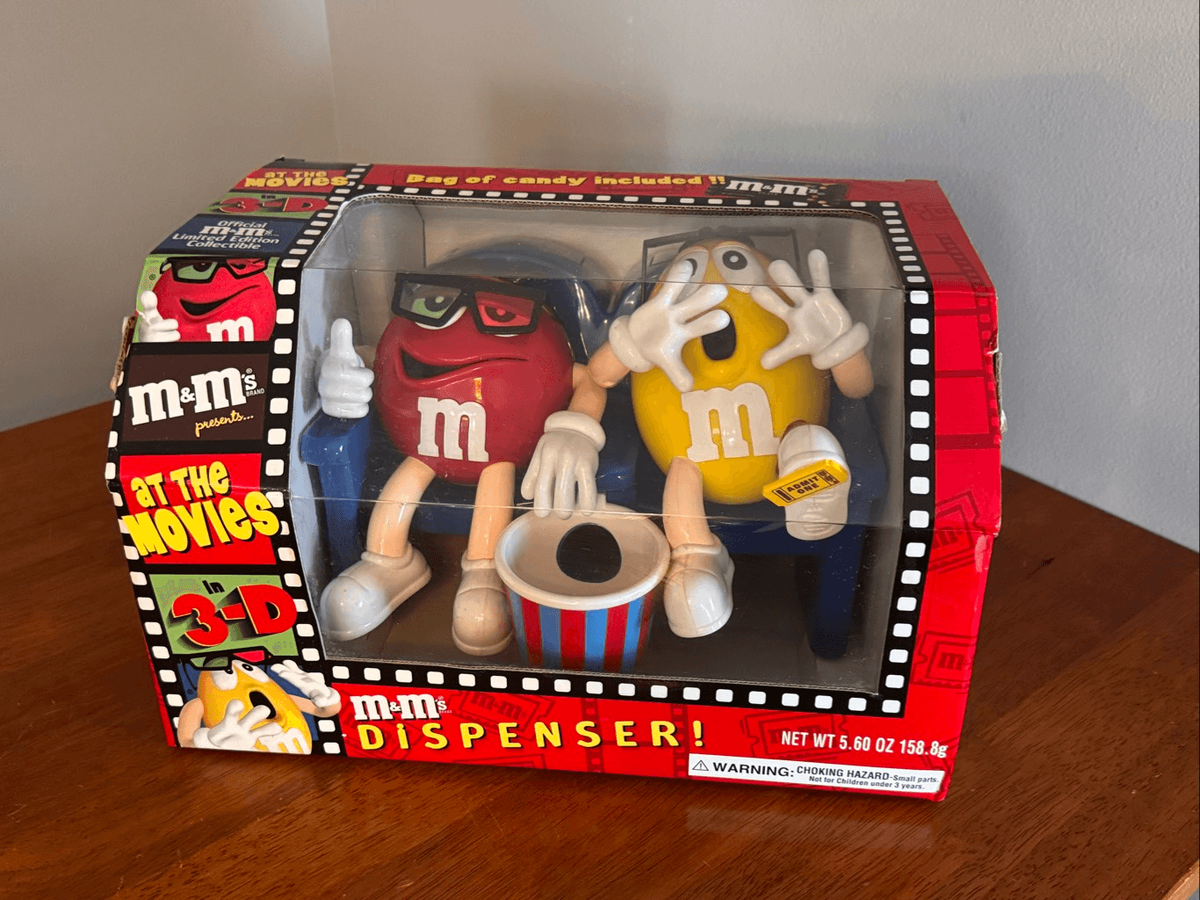 VINTAGE M&M'S RED & YELLOW AT THE MOVIES CANDY DISPENSER for sale