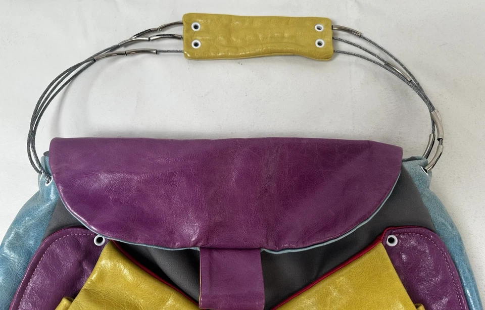 Bolso/cartera de cuero colorido Cirque Du Soleil con mango de correa de alambre guía juguetón Foto 2 de 4