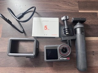 dji action 5 pro camera with spare batteries and tripod immaculate condition.