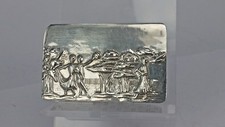 Solid silver pill box with basket weave surround celebration scene to front