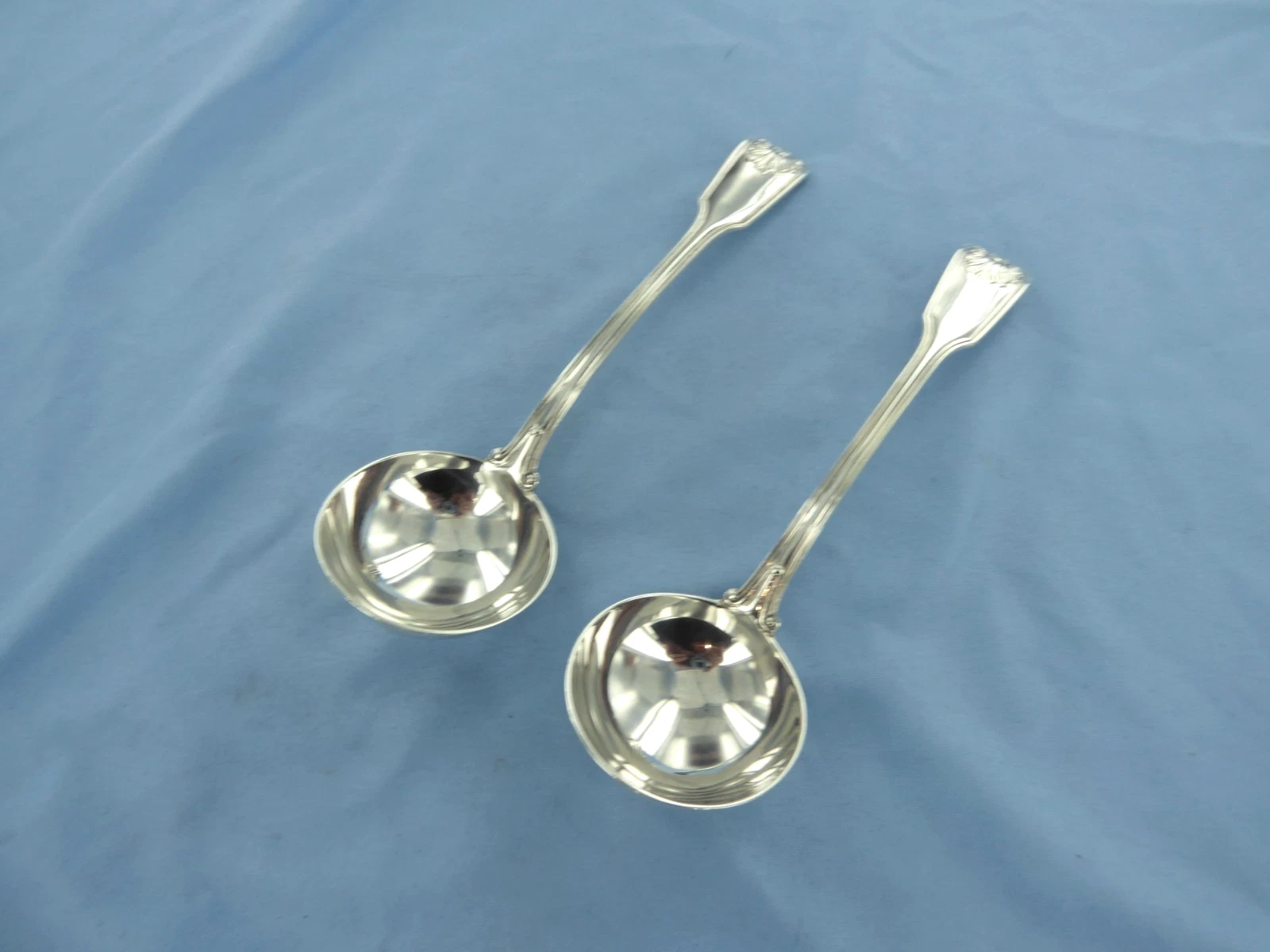 AN ANTIQUE PAIR OF STERLING SILVER FIDDLE THREAD &SHELL SAUCE LADLES,LONDON 1872
Opens in a new wind