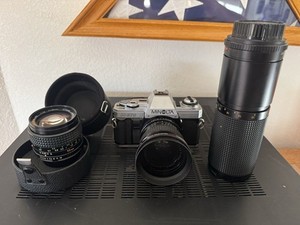 Minolta X-370 35mm Film SLR Camera Kit with 50mm OEM Plus two other lenses