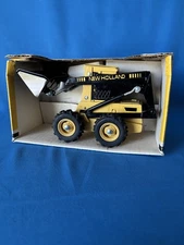 1/16 Ertl New Holland Skid-Steer Loader #320-10E0 Die-Cast 1986, New in worn box