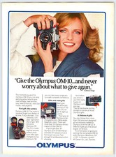1981 OLYMPUS OM-10 CAMERA CHERYL TIEGS Vintage 8" X 11" Magazine Ad 1980's M668