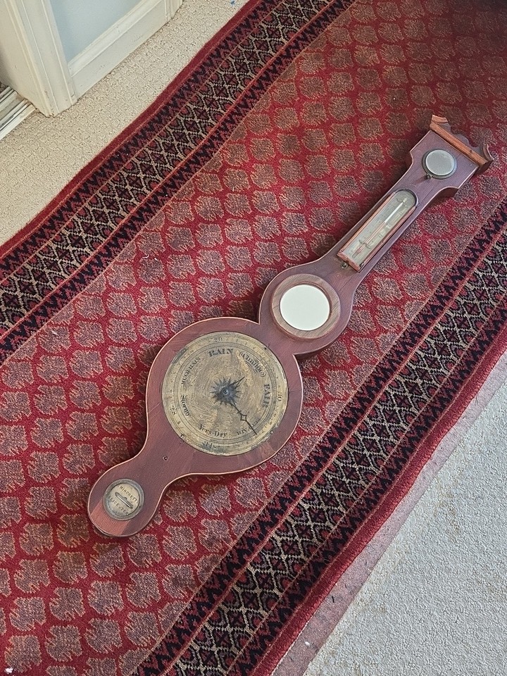 A rare 38-inch Victorian banjo barometer with a bullseye mirror by Minoretti — the kind of statement wall piece that anchors an entire room.