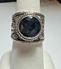 Vintage Sarda Bali Sterling silver black stone ring with swirls on side of band.