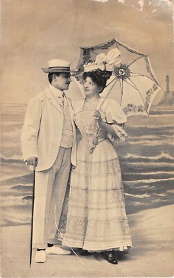 Romantic Old Postcard of Lovers Strolling On a Beach With a Parasol